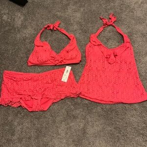 Three piece swimming suit.